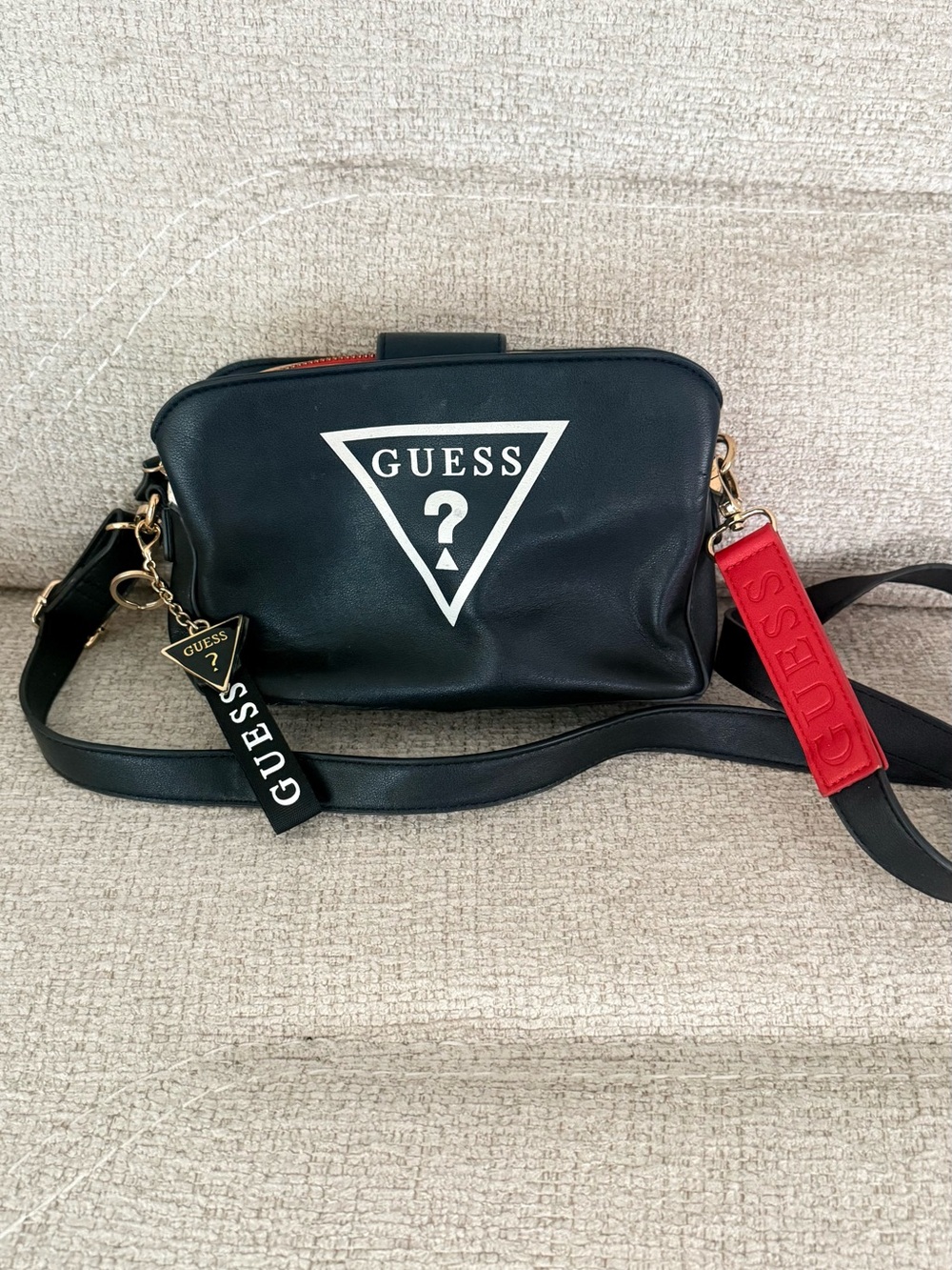 GUESS Black Crossbody Bag with Red Strap Accent